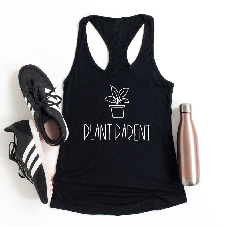 May include: Black tank top with a white outline of a potted plant and the text "PLANT PARENT".