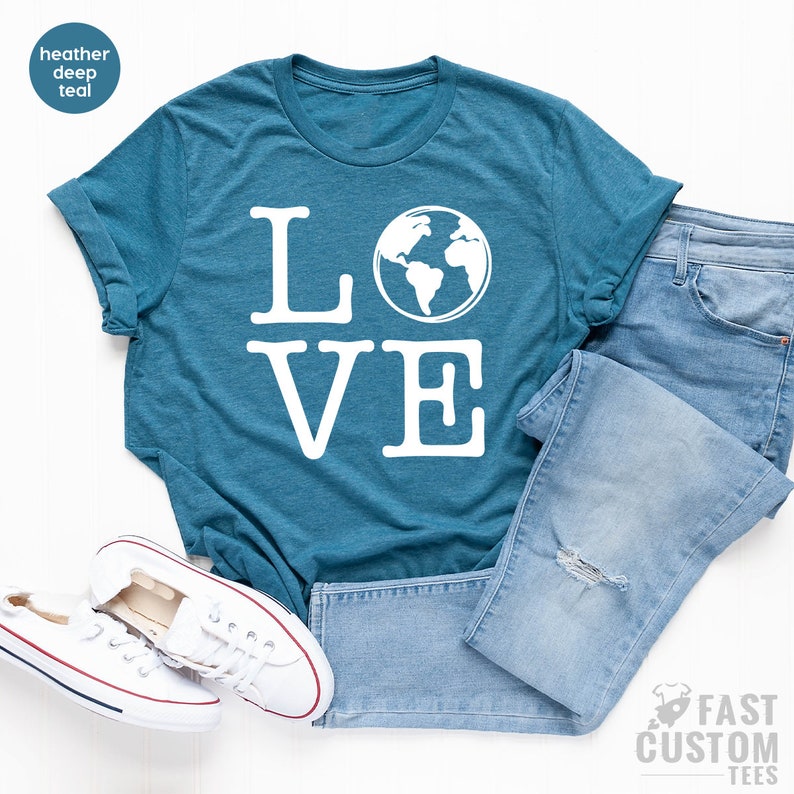May include: A teal blue t-shirt with the word "LOVE" in white text. The "O" in LOVE is replaced with a white outline of the Earth.