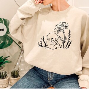 Camisetas con gráficos de nutria, camisetas con animales, camisetas lindas de nutria, camisetas florales, regalos de nutria, camisetas con flores, camisetas de naturaleza, camisetas divertidas de nutria imagen 6