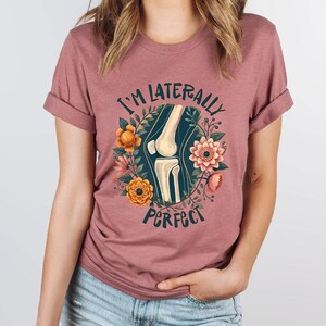 a woman wearing a t - shirt that says i'm literally perfect