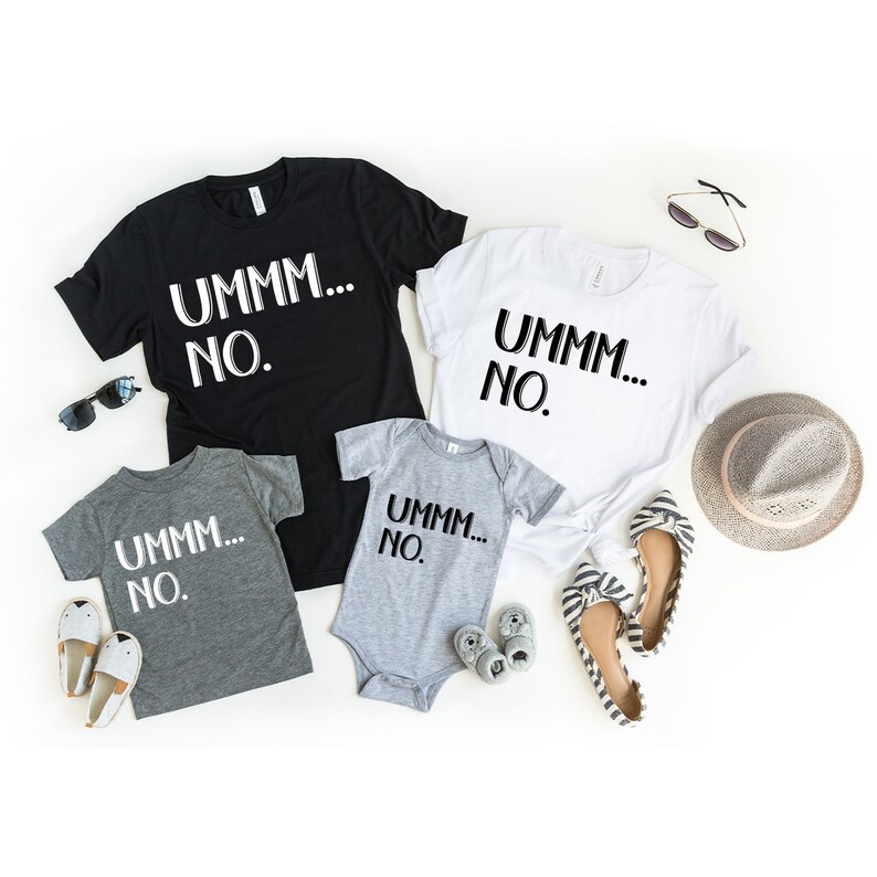 May include: A set of four t-shirts with the text "UMMM... NO." printed on them. The shirts are in black, white, and gray. The shirts are arranged on a white background with sunglasses, a hat, and shoes.