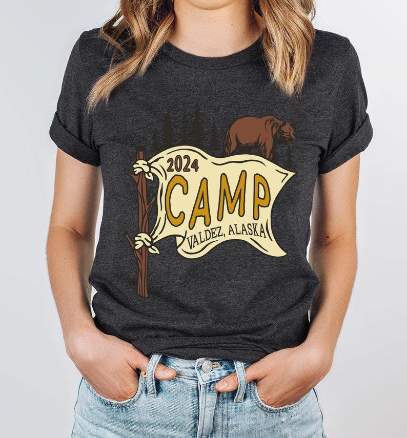 a woman wearing a t - shirt that says camp
