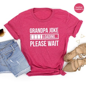 May include: A pink heather raspberry t-shirt with the text "Grandpa Joke" and a progress bar that says "LOADING... PLEASE WAIT".