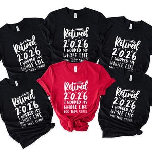 six t-shirts with the same design, featuring the text "Retired 2026 I worked my whole life for this shirt" printed on them in white lettering.