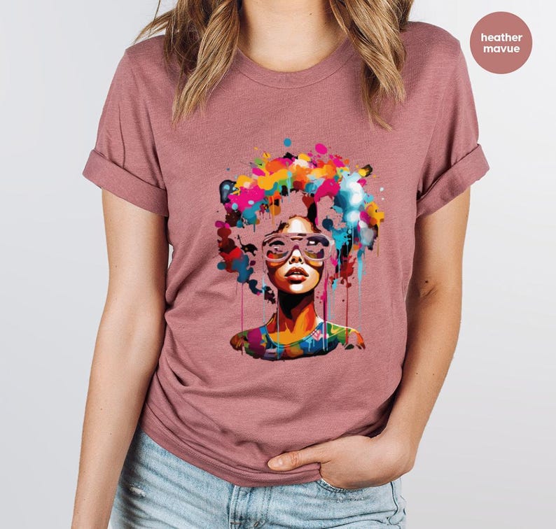 a woman wearing a t - shirt with a picture of a woman's face