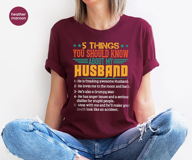 May include: A maroon t-shirt with a white graphic that says "5 THINGS YOU SHOULD KNOW ABOUT MY HUSBAND" and lists five things about a husband.
