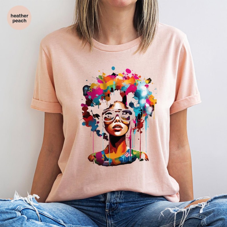 a woman wearing a t - shirt with a picture of a woman's face