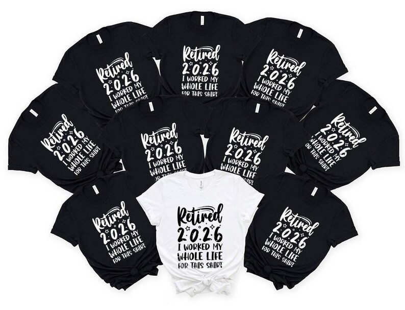 A collection of black t-shirts with white text that reads "Retired 2026 I worked my whole life for this shirt" arranged in a circular pattern.