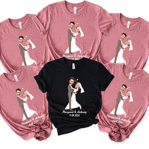 May include: Several pink and one black t-shirts, each with a cartoon illustration of a bride and groom. The bride is in a white dress and veil, the groom in a grey suit. The text "Margaret & Anthony 11.09.2024" is printed on the shirts.