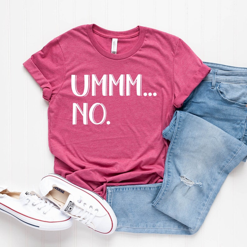 May include: A pink t-shirt with the text "UMMM... NO." in white lettering.