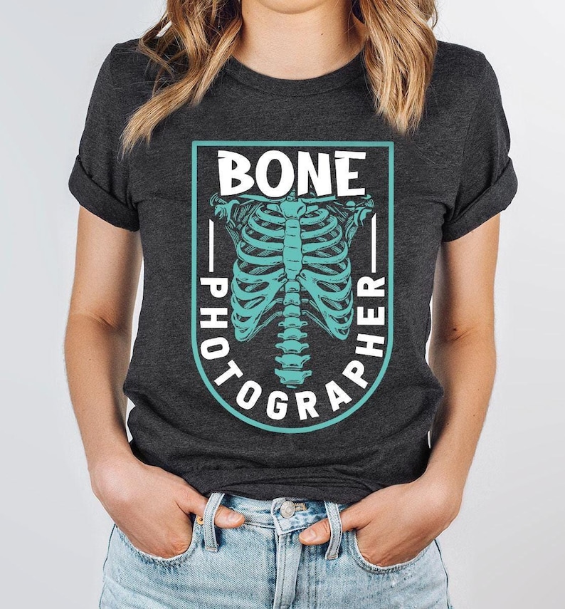 a woman wearing a black shirt with a skeleton on it