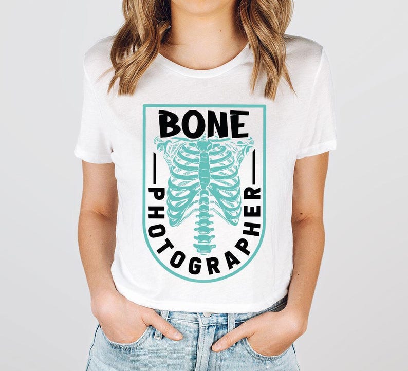 a woman wearing a white shirt with a skeleton on it