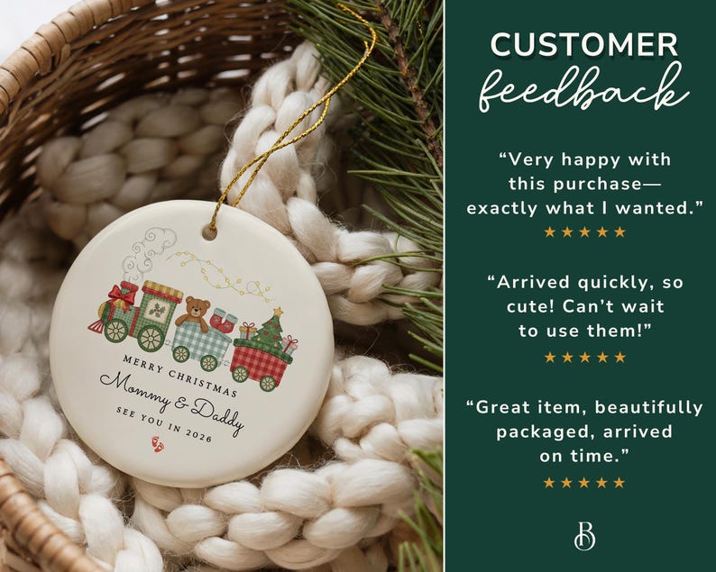 May include: A round Christmas ornament with a train design. The train cars are decorated with a teddy bear, gifts, and a Christmas tree. The text reads "Merry Christmas Mommy & Daddy See You in 2026". The ornament is cream-colored with a gold string.