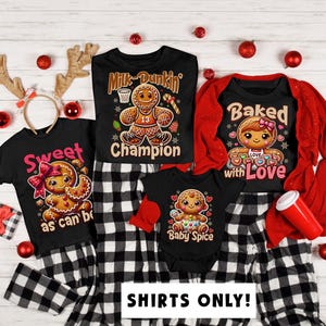 May include: A set of four black t-shirts with gingerbread people graphics and Christmas-themed text. The shirts feature the phrases "Milk-Dunkin' Champion", "Sweet as can be", "Baked with Love", and "Baby Spice".
