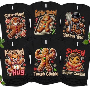 May include: Set of six black t-shirts with gingerbread man illustrations and Christmas-themed puns. The shirts feature phrases like "Bite-Mee!" "Gettin' Baked" "Kneed a Hug" "Tough Cookie" "Spicy Sugar Cookie" and "Baking Bad".