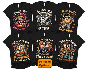 May include: Set of 10 black t-shirts with funny pie and pumpkin themed designs. The shirts feature illustrations of pies, pumpkins, and people with text like "Don't Go Baking My Tart", "Sweet Pie O'Mine", "Pie Will Survive", "Let's Give 'em Pumpkin to Talk About", "You're the Bun That I Want", and "Take Me Home Country Rolls".