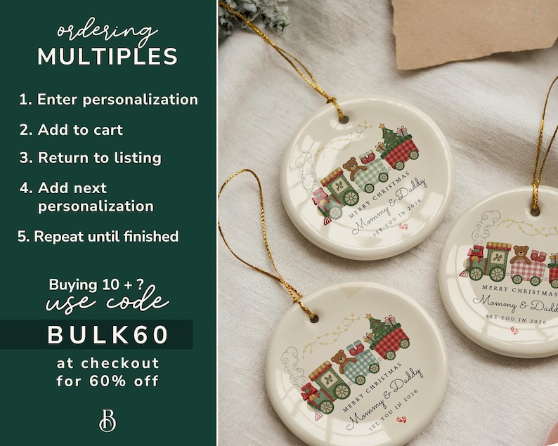 May include: Three round ceramic Christmas ornaments with gold string. Each ornament features a train design with teddy bears and the text "Merry Christmas Mommy & Daddy". The ornaments are cream-colored.