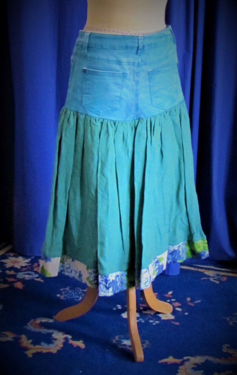 Upcycled denim skirt: Turquoise jeans with shot linen and floral linen border. image 1