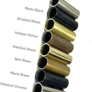 May include: A collection of cylindrical metal tubes in various finishes, including Brushed Chrome, Matte Black, Brushed Brass, Antique Patina, Polished Brass, Raw Brass, Black Brass, and Polished Chrome. The text labels each finish.