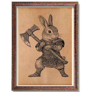 May include: A framed print showing a black and white illustration of a rabbit warrior with an axe. The rabbit is wearing armour and stands on a tan background. The frame is brown with a decorative border.