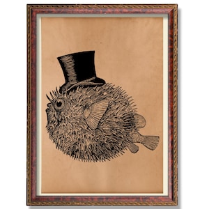 May include: A framed print showing a detailed black and white illustration of a pufferfish wearing a black top hat. The artwork is set against a tan background and framed in a dark wood frame with gold accents. The image has a vintage, whimsical feel.