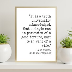 May include: A framed print with a gold border features a quote from Jane Austen's "Pride and Prejudice." The text reads, "It is a truth universally acknowledged, that a single man in possession of a good fortune, must be in want of a wife." Decorative plants in white pots are either side.
