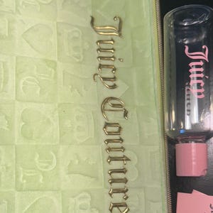 NEW Juicy Couture Travel Cosmetic Bag- Key Lime, soft felt texture, comes with travel size bottle.