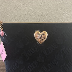 NEW Juicy Couture Travel Cosmetic Bag- Black comes with travel size bottle.