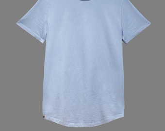 May include: A light blue short-sleeved t-shirt with a rounded hem.