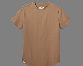 May include: A brown short-sleeved t-shirt with a curved hem. The t-shirt has a small black tag with the text "H&M" on the front.