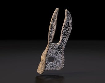 May include: A rabbit mask featuring a dual-textured design with a solid, light-colored front section and a complex, silver-toned metallic lattice structure forming the ears and the remainder of the face, including a circular eye opening.