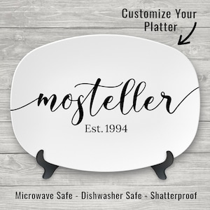 May include: White oval serving platter with black cursive text that reads "mosteller Est. 1994". The platter is microwave, dishwasher, and shatterproof.