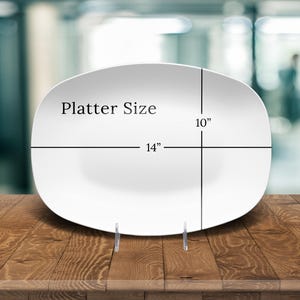 May include: White oval platter with "Platter Size" and measurements of 14 inches by 10 inches.
