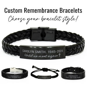 May include: Three black leather bracelets with engraved metal plates. The top bracelet has the text "CAROLYN SMITH, 1945-2024 Until we meet again" engraved on the plate. The other two bracelets have the text "ENGRAVED TEXT/DESIGN HERE" on the plates.