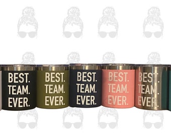 May include: Seven stainless steel tumblers with a white inscription that reads "BEST. TEAM. EVER." The tumblers are in various colours: white, black, green, navy blue, pink, silver, and teal.