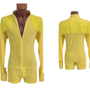 May include: A yellow long-sleeved bodysuit with a zip down the front and fringe trim around the neckline and sleeves.