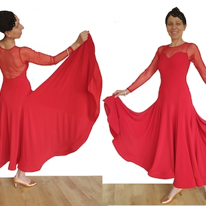 May include: A red dance dress with a sheer mesh bodice and long sleeves. The skirt is full and flowing, with a slight ruffle at the hem.