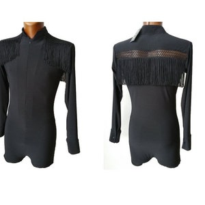 May include: Black long-sleeved shirt with a high collar and fringe trim. The shirt has a zip fastening and a mesh panel on the back.