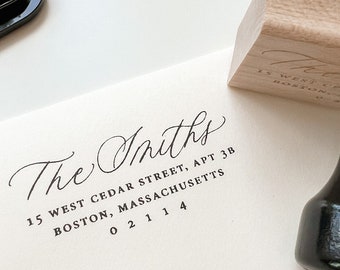 May include: A white envelope with a black ink stamp that reads "The Smiths 15 West Cedar Street, Apt 3B Boston, Massachusetts 02114".