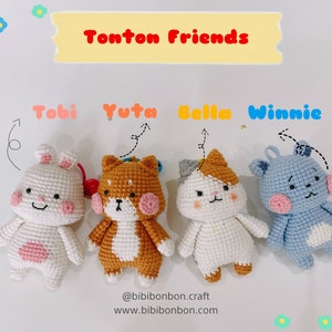 May include: Four crocheted plush toys, a bunny, a cat, a dog, and a bear, with different colored fur. The toys are arranged in a row and labeled with their names: Tobi, Yuta, Bella, and Winnie. The text "Tonton Friends" is written above the toys.