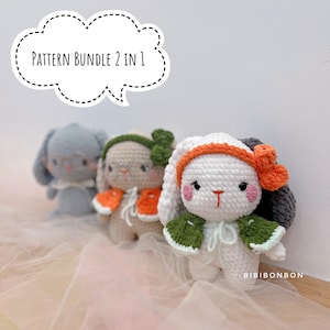 May include: Three crocheted bunny dolls in a row, each with unique features. The bunnies are white, tan, and blue, with orange, green, and gray accents. The text "PATTERN BUNDLE 2 IN 1" is in a speech bubble above the dolls. The dolls have pink cheeks and are wearing accessories.