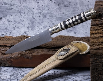 Knife with braided leather handle. Knife with braided leather and alpaca handle. Knife with braided handle and box. Made in Argentina