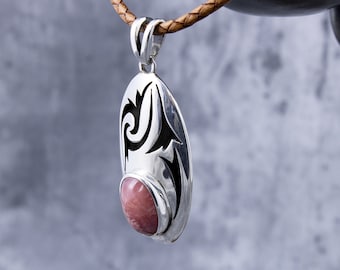 Silver pendant with rhodochrosite. Silver pendant with rhodochrosite, Argentina's national stone. Beautiful hand-crafted piece.