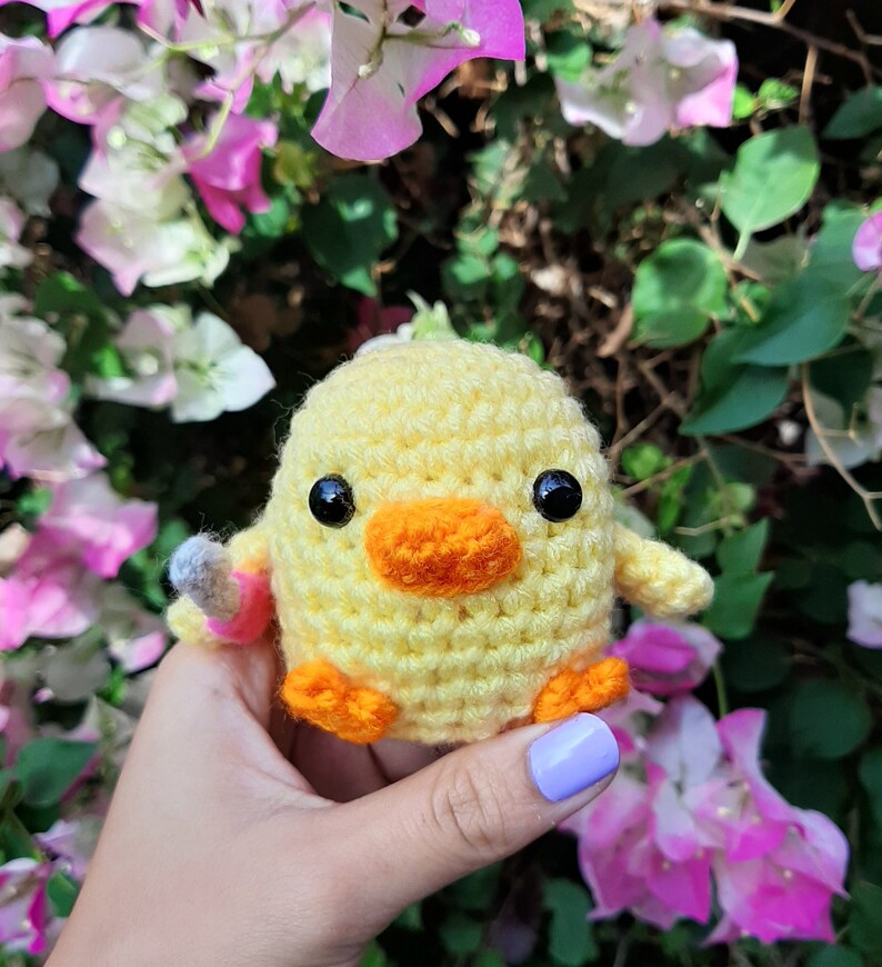 cute duck plush with knife