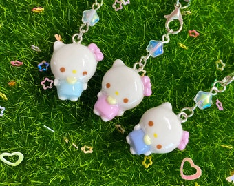 ヴィンテージ ハローキティ ハワイ チャーム：日焼け肌のフラ