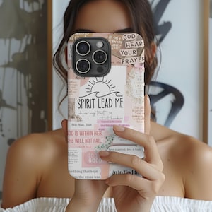 May include: A phone case with a collage design featuring the text "SPIRIT LEAD ME" and other inspirational phrases. The case has a light pink and beige color scheme with floral and sun graphics.