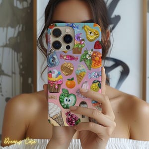 May include: A colorful phone case with a variety of fruits, sweets, and other designs. The case is made of a hard plastic material and has a glossy finish.