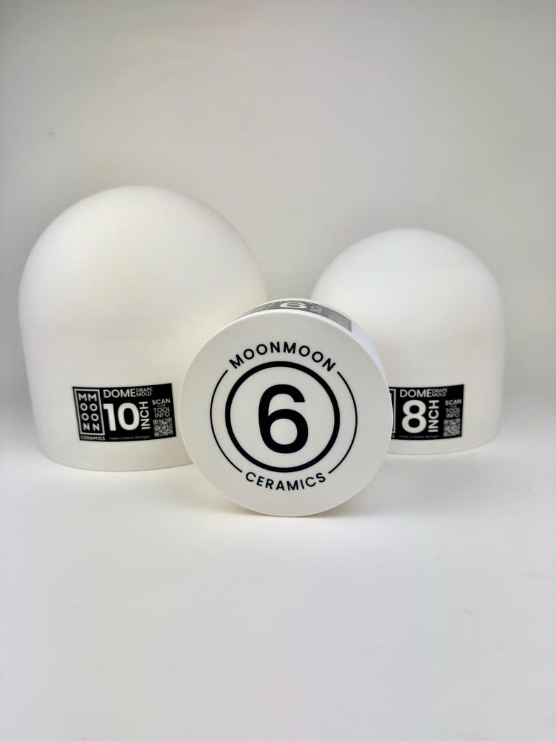 May include: Three white ceramic dome drape molds of varying sizes. The largest mold is labeled 10 inch, the middle mold is labeled 6, and the smallest is labeled 8 inch. Each mold features the Moonmoon Ceramics logo and a QR code for tool info.