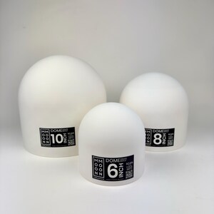 May include: Three white ceramic dome drape molds of varying sizes. Each mold features a black label with the text MM MOON CERAMICS, DOME DRAPE MOLD, a QR code, and the specific size labeled as 10 inch, 8 inch, and 6 inch respectively.