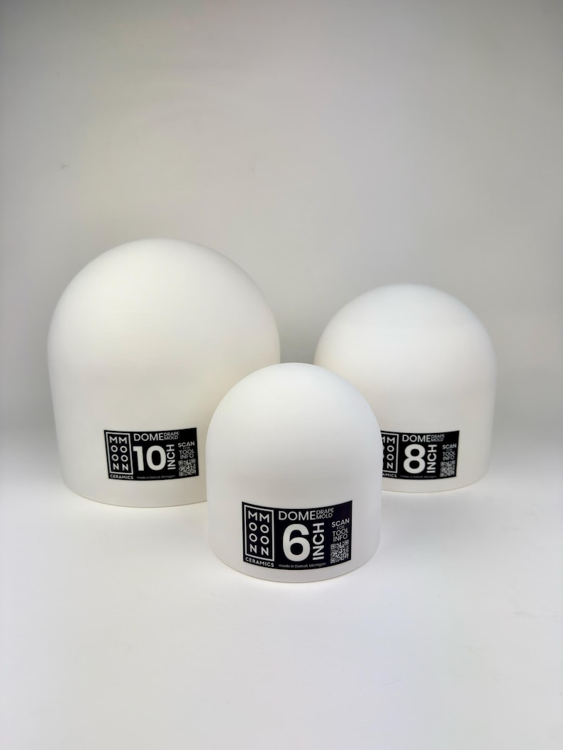 May include: Three white ceramic dome drape molds of varying sizes. Each mold features a black label with the text MM MOON CERAMICS, DOME DRAPE MOLD, a QR code, and the specific size labeled as 10 inch, 8 inch, and 6 inch respectively.